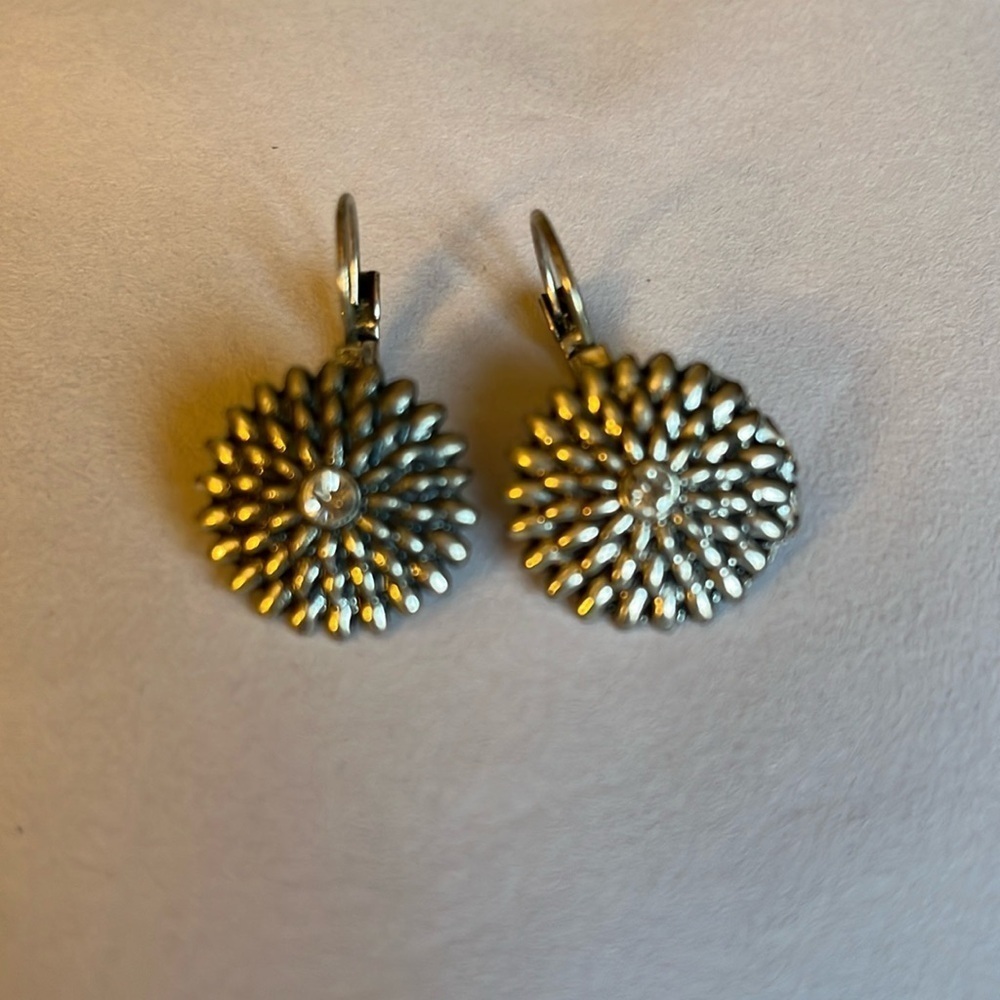 Antiqued silver chrysanthemum with rhinestone center lever back earrings.
